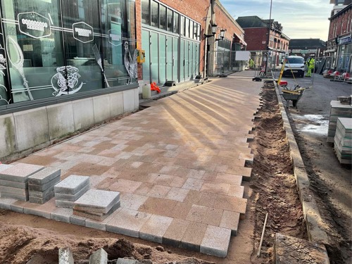 A progress picture of new pink pavement tiles on Market Street - January 2025