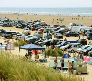 Cars parked on beach