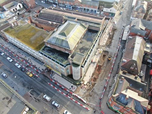 An aerial view of King Street, there is a lot of red and white fencing and some of the pavement is dug up - February 2025